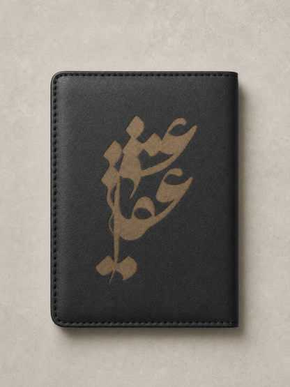 Black vegan leather passport cover laser engraved with gold Persian calligraphy, personalized passport holder by Maryam Collective