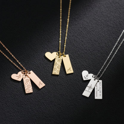 Personalized heart and bar necklaces in rose gold, gold, and silver engraved with custom names, initials, and coordinates